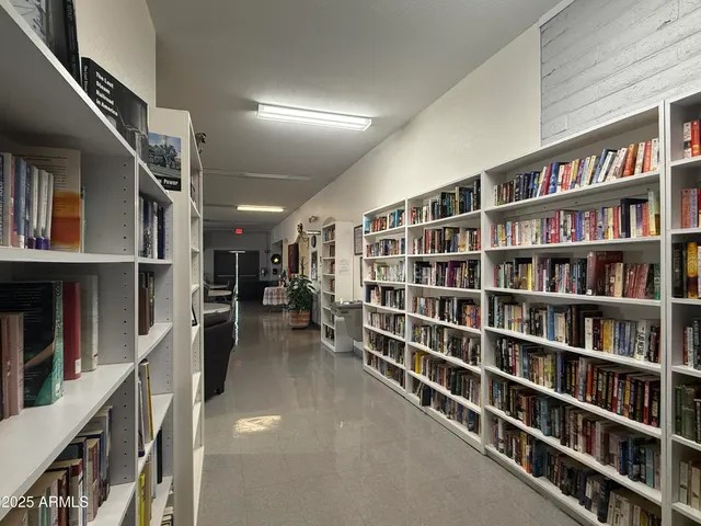 a kitchen with a sink appliances and cabinets