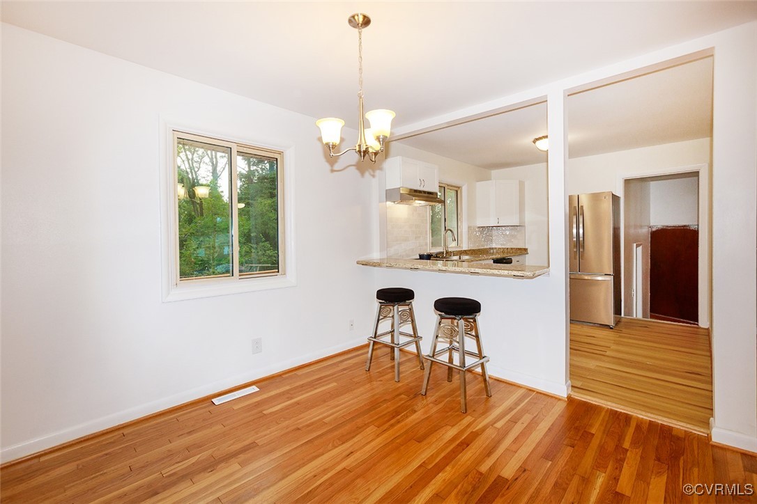 118 Winston Drive Williamsburg, VA 23185 - Photo 13 of 28 a view of a kitchen with wooden floor and a window