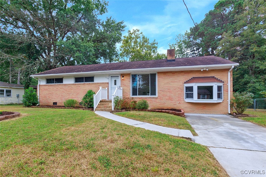 118 Winston Drive Williamsburg, VA 23185 - Photo 26 of 28 a front view of a house with garden
