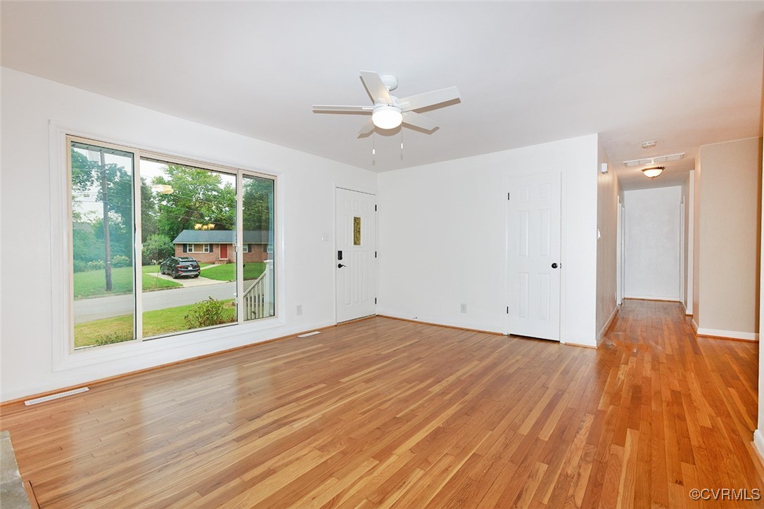 118 Winston Drive Williamsburg, VA 23185 - Photo 6 of 28 a view of empty room with wooden floor and fan