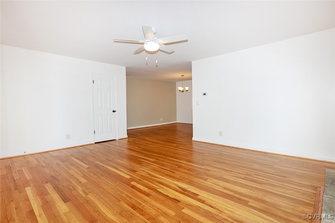 118 Winston Drive Williamsburg, VA 23185 - Photo 7 of 28 an empty room with wooden floor and fan