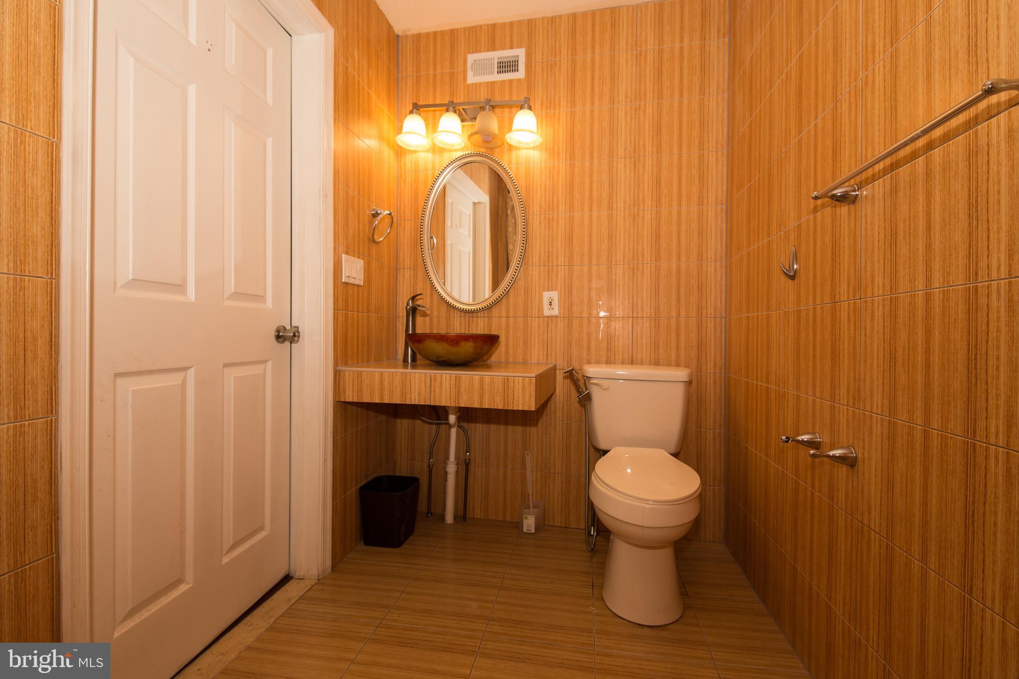 724 East Locust Avenue Philadelphia, PA 19144 - Photo 18 of 34 a bathroom with a toilet and a sink