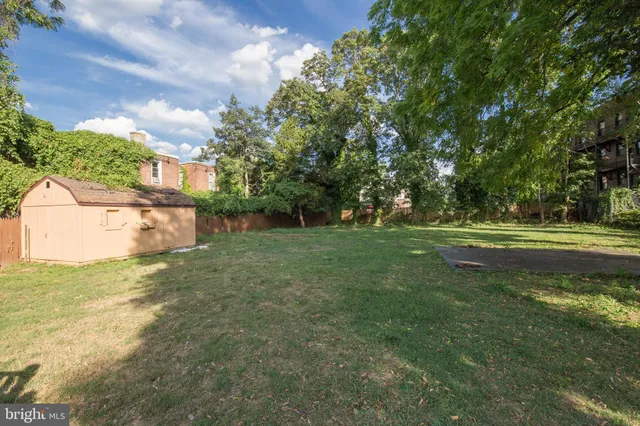 a view of a garden with a house