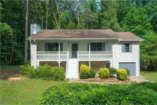a house view with a garden space