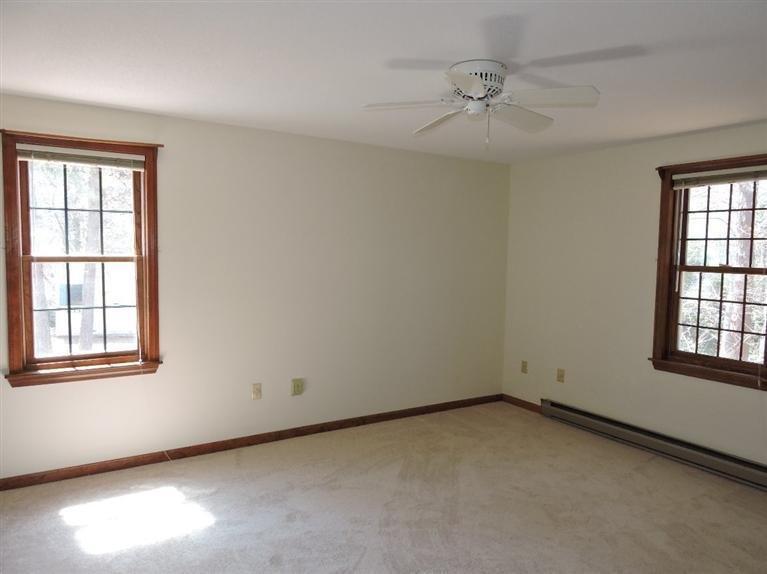 130 Surf Drive Mashpee, MA 02649 - Photo 12 of 29 an empty room with windows and closet