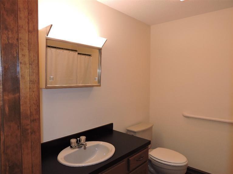 130 Surf Drive Mashpee, MA 02649 - Photo 17 of 29 a bathroom with a sink a toilet and mirror