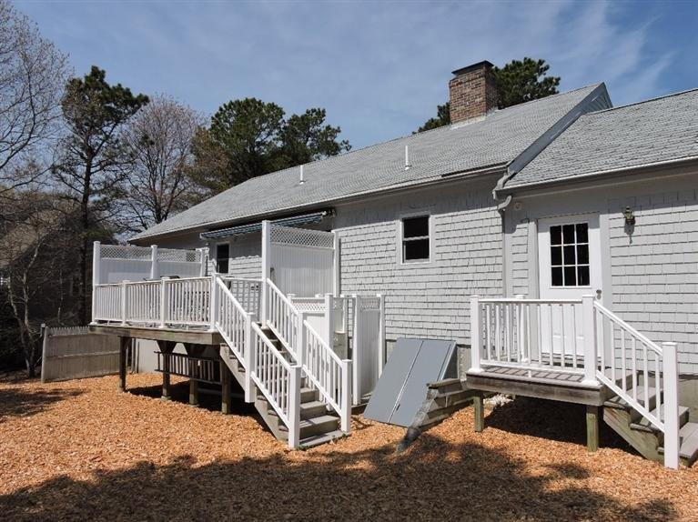 130 Surf Drive Mashpee, MA 02649 - Photo 21 of 29 a view of house with a roof deck