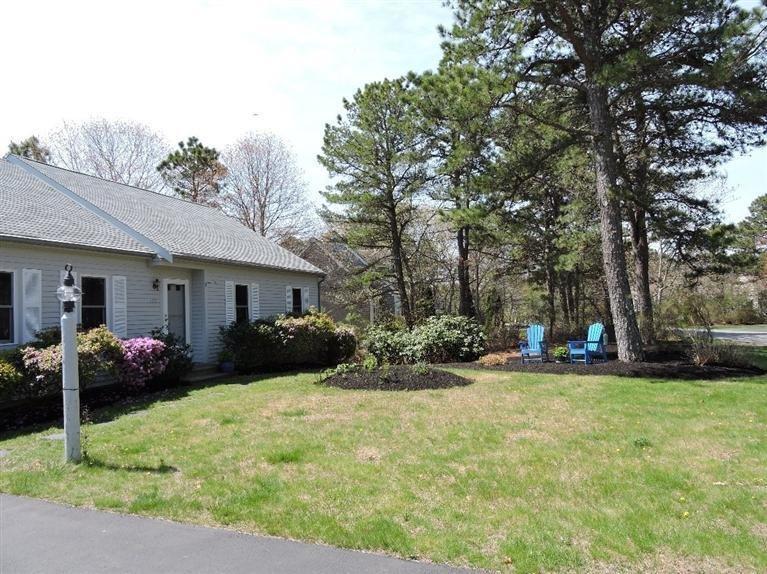 130 Surf Drive Mashpee, MA 02649 - Photo 27 of 29 a view of a house with a yard and sitting area