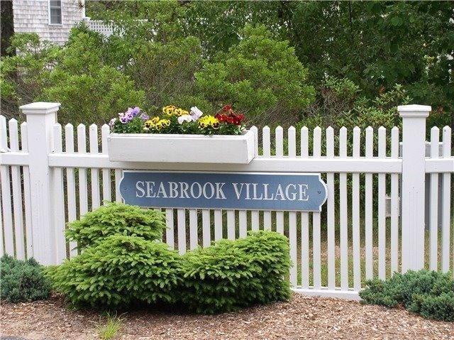 130 Surf Drive Mashpee, MA 02649 - Photo 28 of 29 a view of a wooden house and a bench