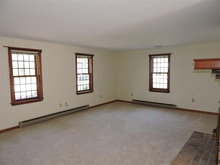 130 Surf Drive Mashpee, MA 02649 - Photo 4 of 29 an empty room with windows