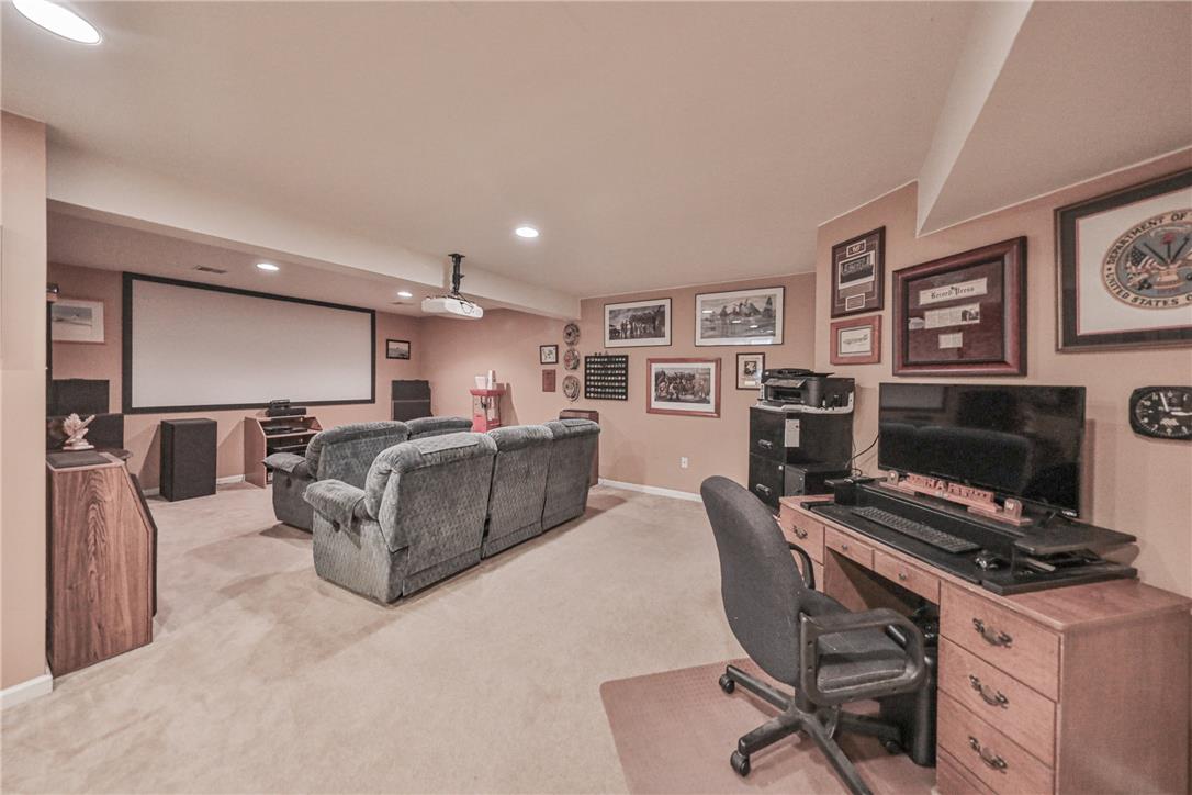 138 Clover Hollow Road Easton, PA 18045 - Photo 67 of 95 A dedicated home theater area with ample seating offers an inviting space for entertainment.
