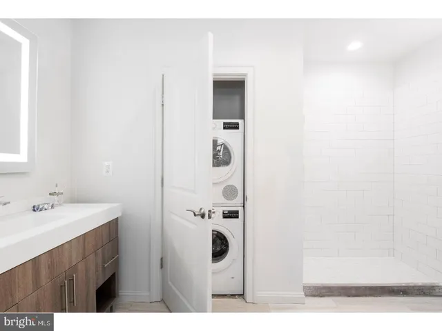 a bathroom with a sink mirror and double