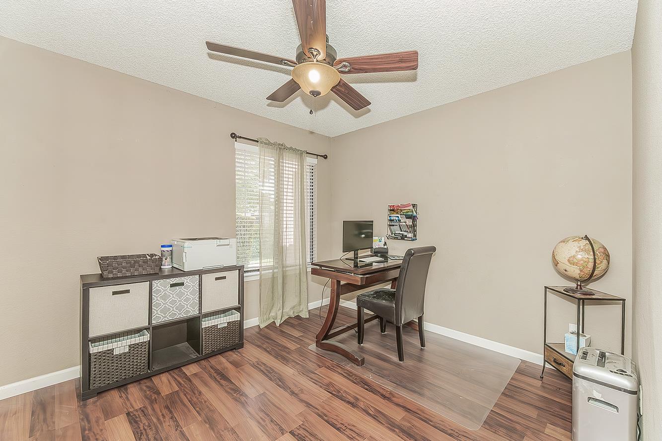 1908 East Niles Avenue Fresno, CA 93720 - Photo 21 of 30 a view of a workspace with furniture and a window
