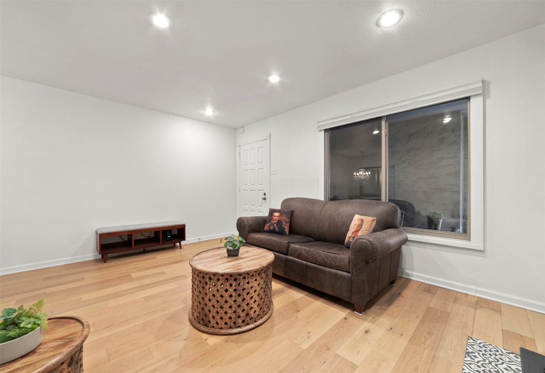 505 West 7th Street, Unit 113 Austin, TX 78701 - Photo 7 of 26 a living room with furniture and a rug