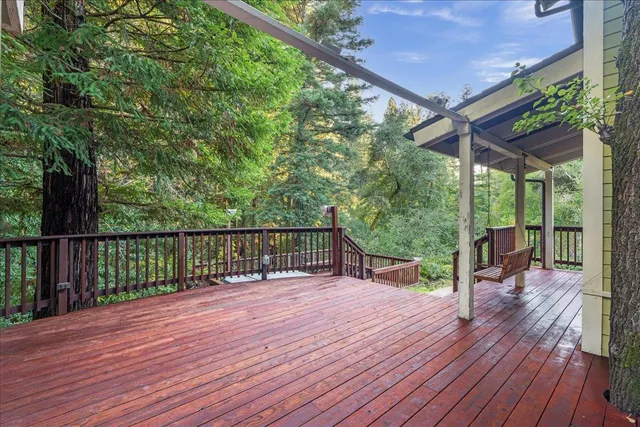 a view of a deck with wooden floor and outdoor space