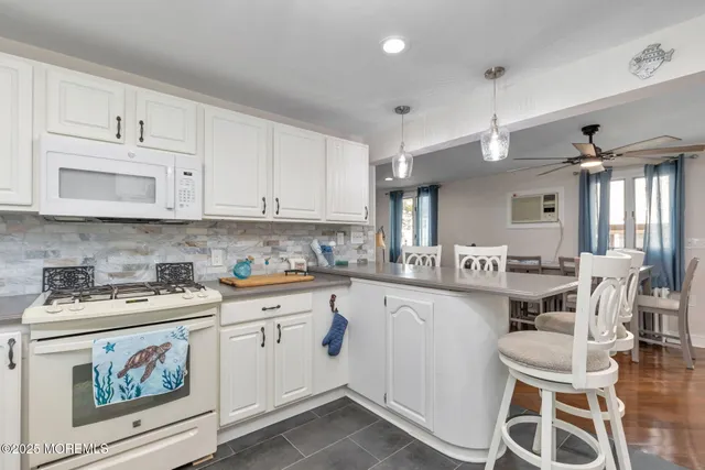 a kitchen with a sink cabinets and window
