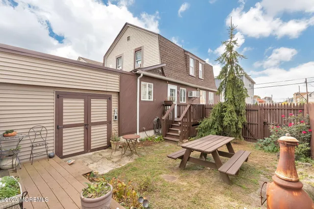 a view of a patio with a table and chairs