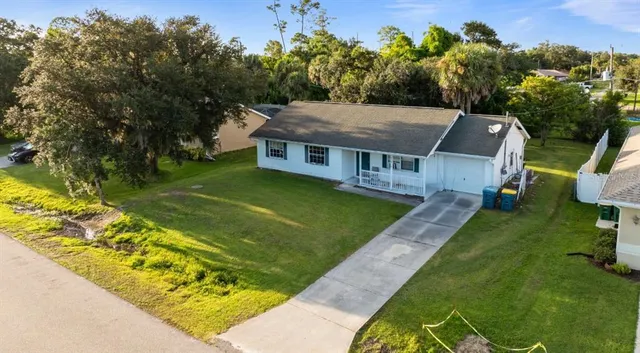 a aerial view of a house with a yard