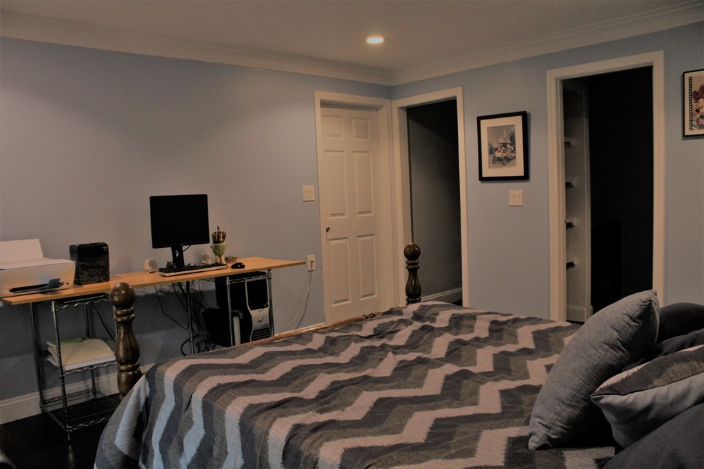 10 Shadowbrook Lane, Unit 19 Milford, MA 01757 - Photo 12 of 22 a bedroom with a bed and a desk