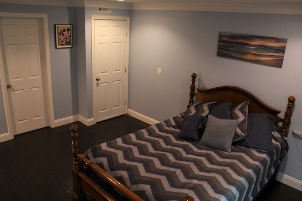 10 Shadowbrook Lane, Unit 19 Milford, MA 01757 - Photo 13 of 22 a bedroom with a bed and a window