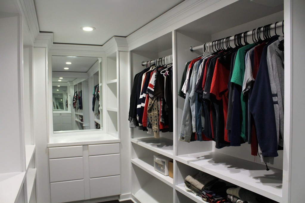 10 Shadowbrook Lane, Unit 19 Milford, MA 01757 - Photo 14 of 22 a view of walk in closet with clothes and shoes