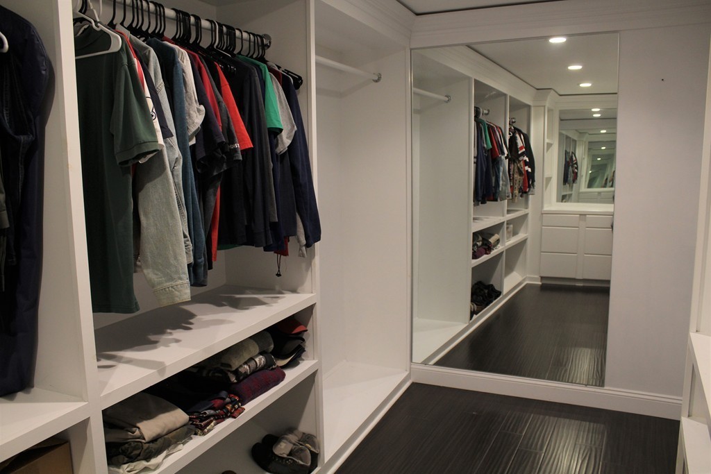 10 Shadowbrook Lane, Unit 19 Milford, MA 01757 - Photo 16 of 22 a view of walk in closet with clothes and shoes