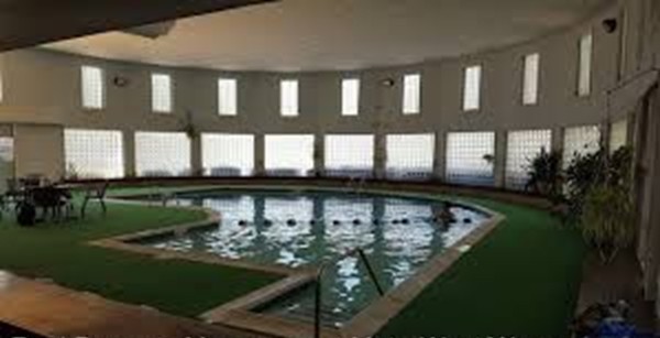 10 Shadowbrook Lane, Unit 19 Milford, MA 01757 - Photo 22 of 22 a view of a swimming pool with a garden
