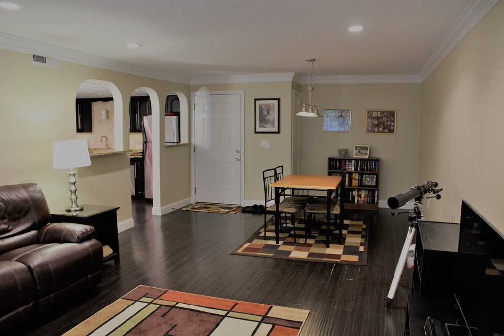 10 Shadowbrook Lane, Unit 19 Milford, MA 01757 - Photo 6 of 22 a living room with furniture rug and wooden floor