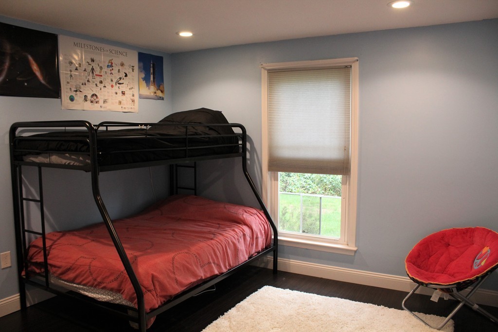 10 Shadowbrook Lane, Unit 19 Milford, MA 01757 - Photo 10 of 22 a bedroom with a bed and a window