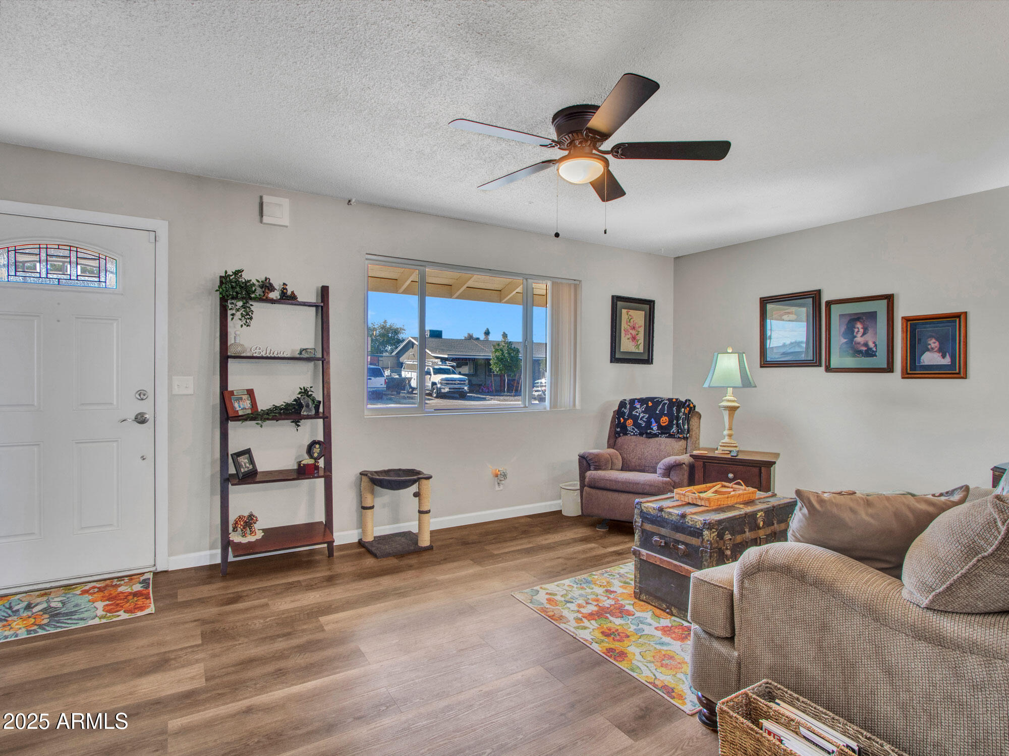 3328 West Charter Oak Road Phoenix, AZ 85029 - Photo 18 of 39 a living room with furniture and window