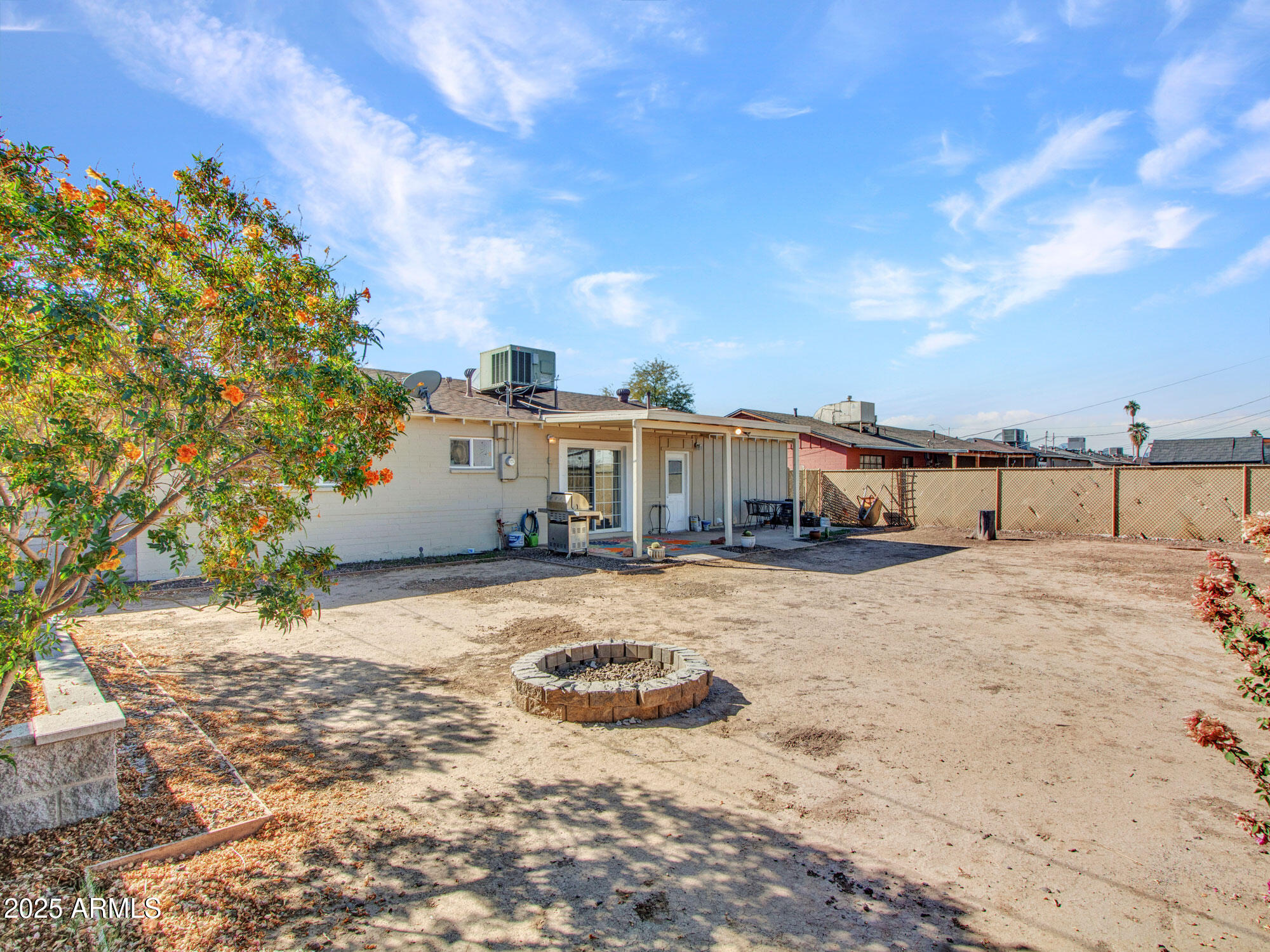 3328 West Charter Oak Road Phoenix, AZ 85029 - Photo 26 of 39 a view of a house with wooden fence