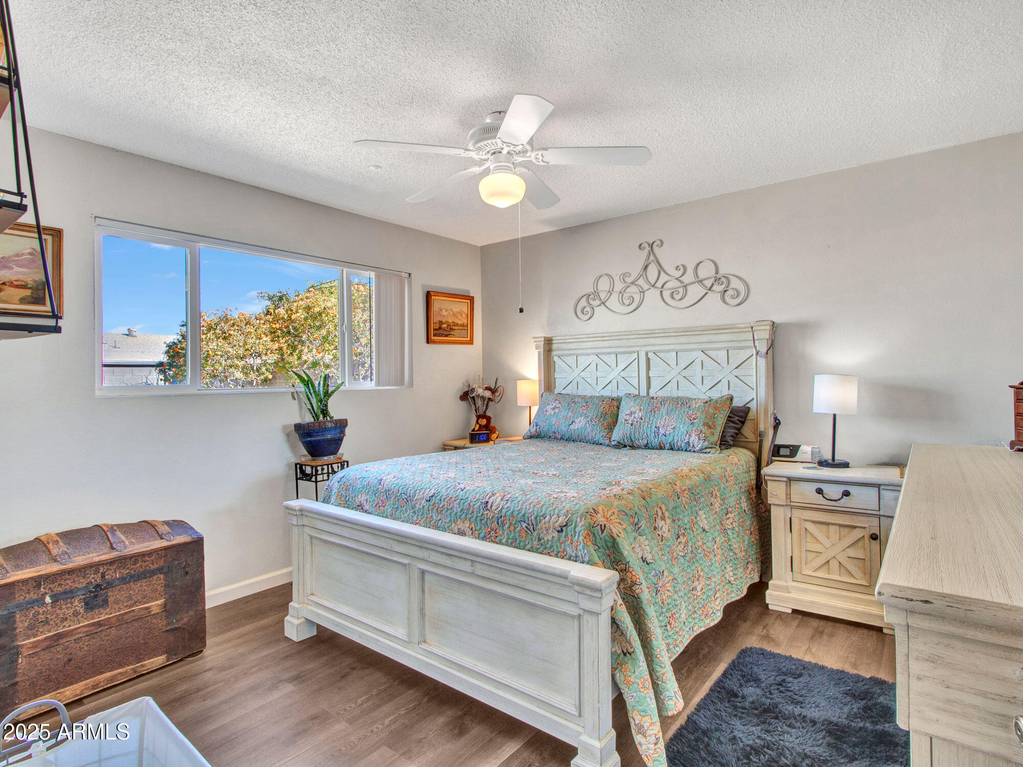 3328 West Charter Oak Road Phoenix, AZ 85029 - Photo 30 of 39 a bedroom with a bed and a chandelier