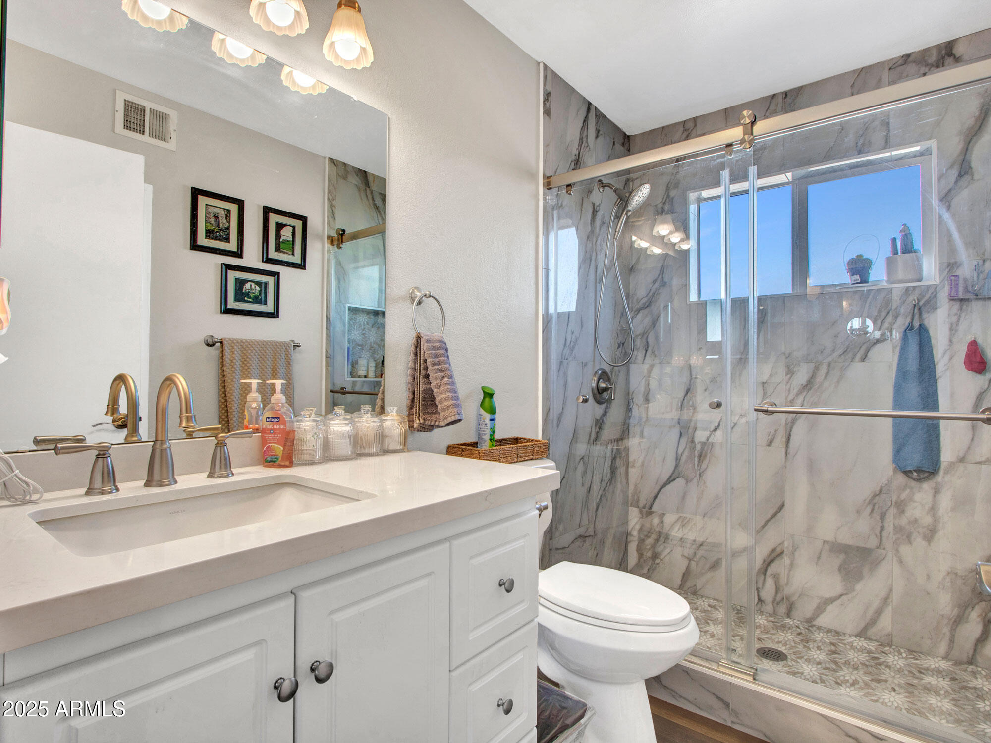 3328 West Charter Oak Road Phoenix, AZ 85029 - Photo 33 of 39 a bathroom with a sink toilet and shower