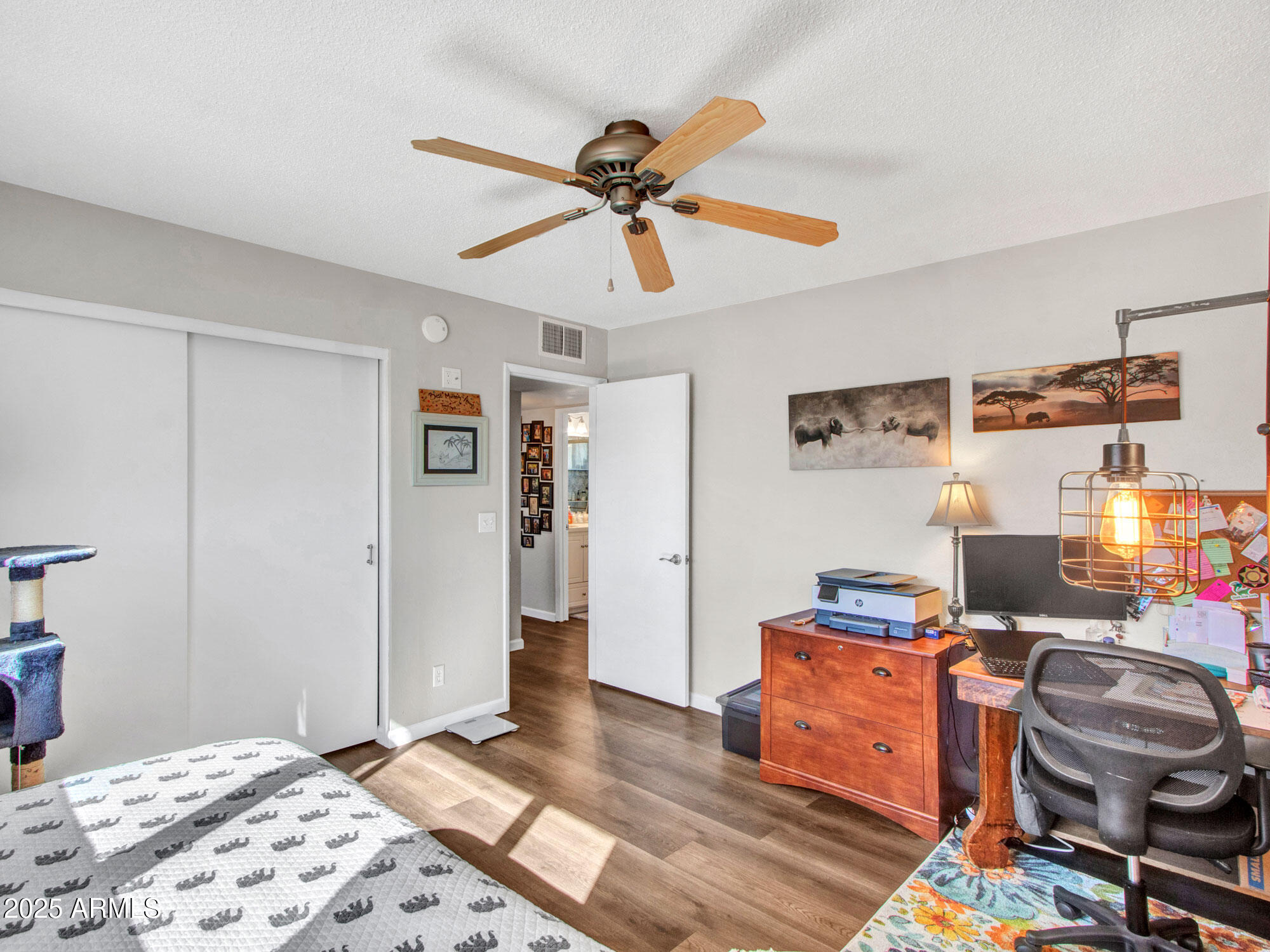 3328 West Charter Oak Road Phoenix, AZ 85029 - Photo 35 of 39 a bedroom with furniture and a bed
