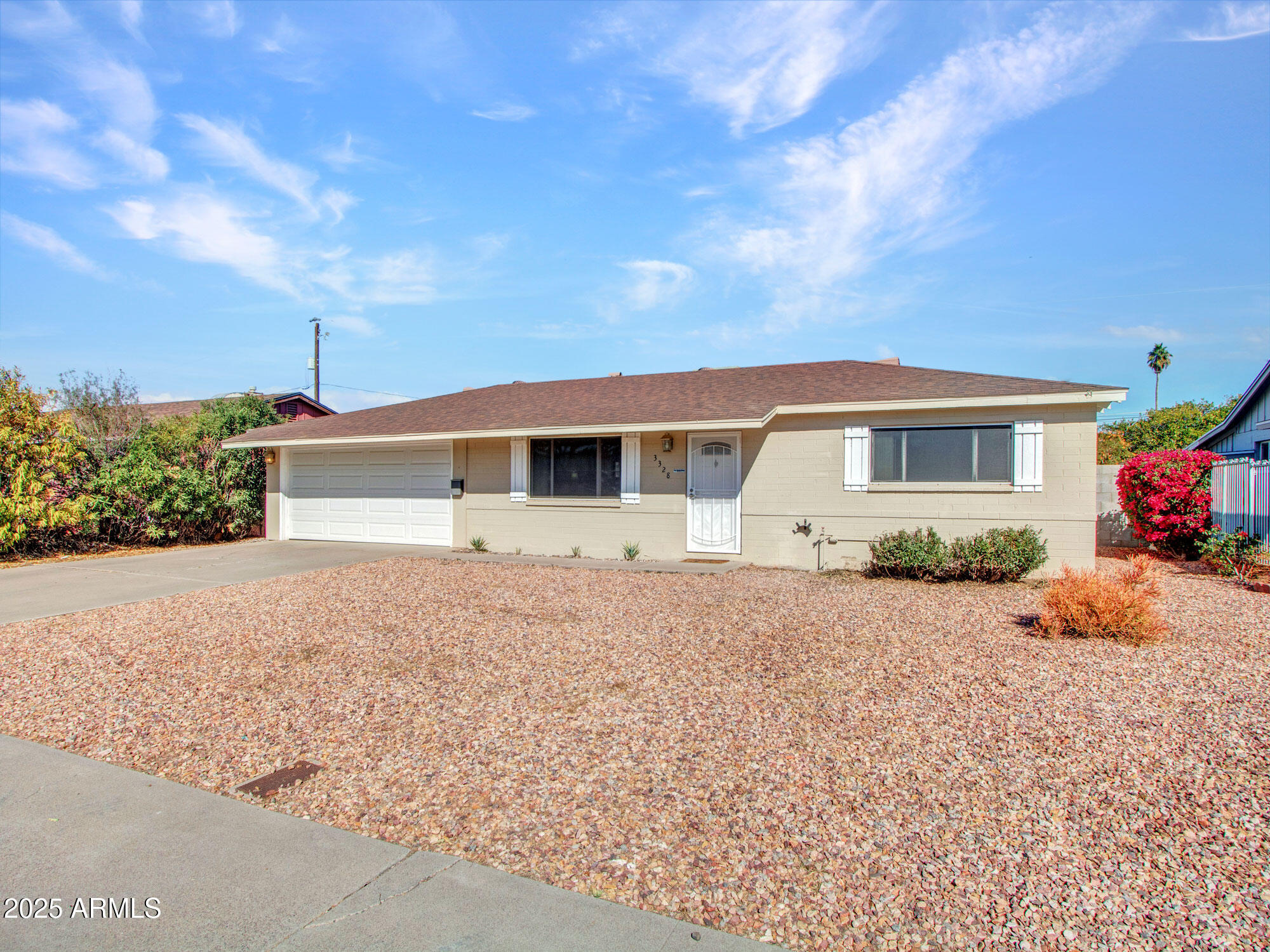 3328 West Charter Oak Road Phoenix, AZ 85029 - Photo 38 of 39 a front view of a house with a yard