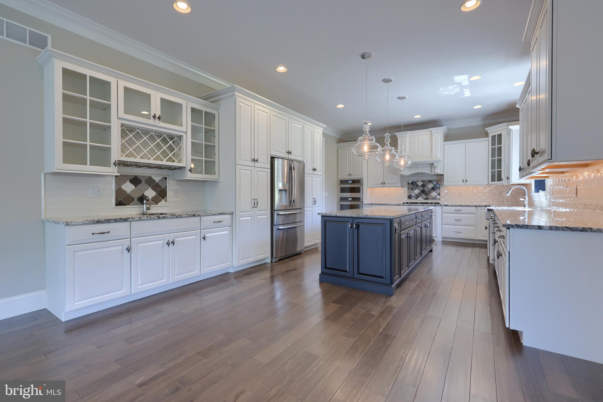 428 Southampton Drive Lititz, PA 17543 - Photo 23 of 60 a kitchen with stainless steel appliances granite countertop a refrigerator a sink dishwasher a stove with wooden floors and cabinets