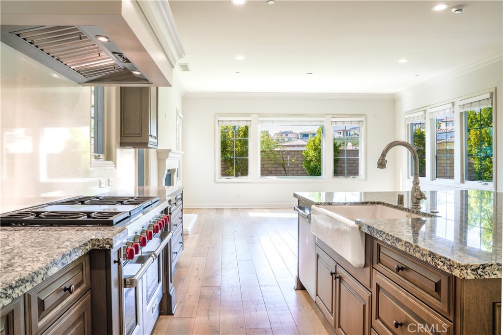 111 Lanzon Irvine, CA 92602 - Photo 12 of 42 a kitchen with stainless steel appliances granite countertop a sink and a stove