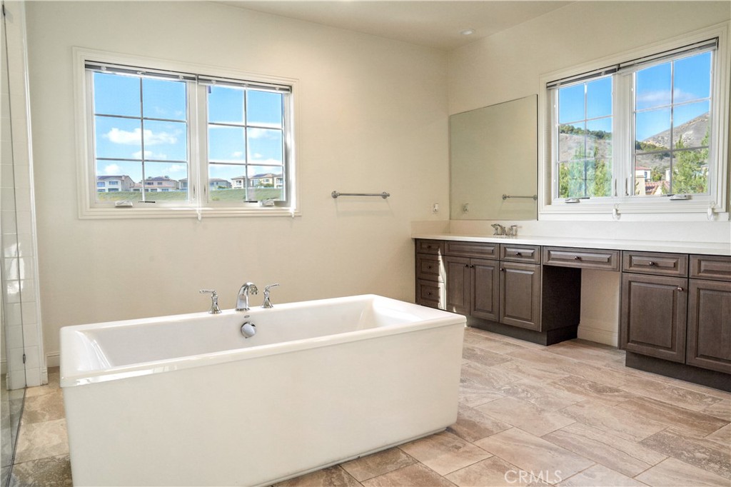 111 Lanzon Irvine, CA 92602 - Photo 25 of 42 a spacious bathroom with sink bathtub and window