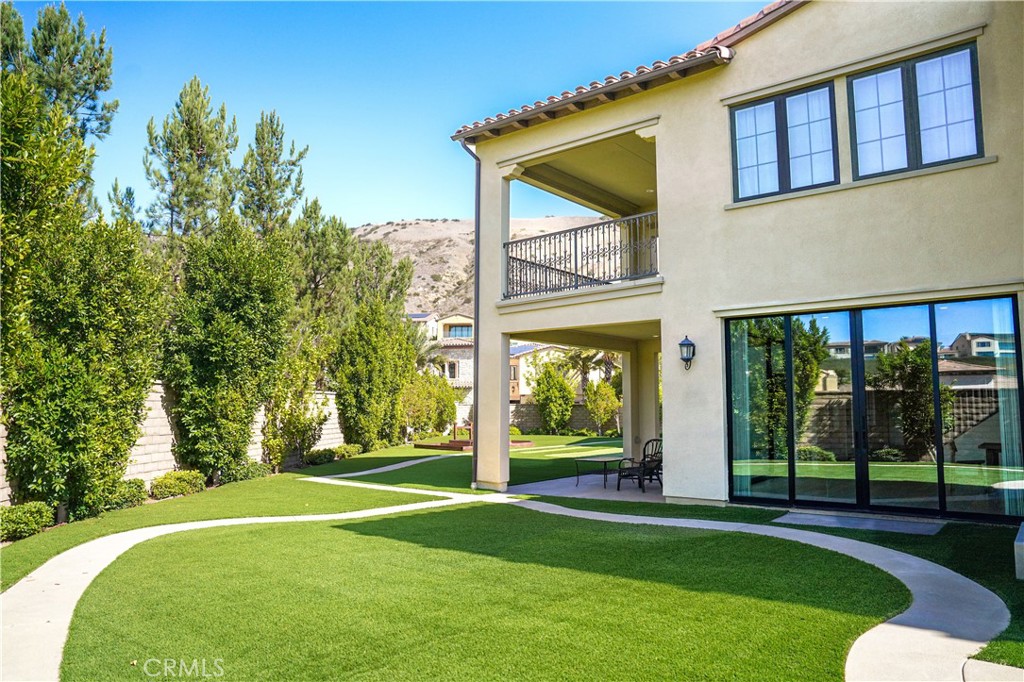 111 Lanzon Irvine, CA 92602 - Photo 31 of 42 a view of a house with a backyard and a patio