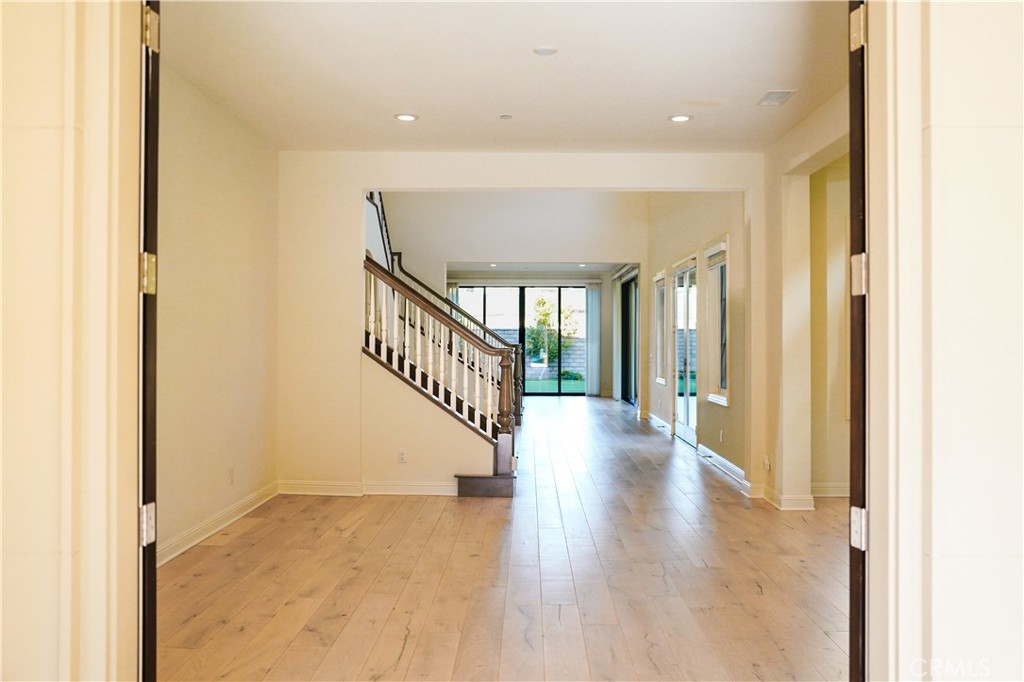 111 Lanzon Irvine, CA 92602 - Photo 32 of 42 a view of a hallway with wooden floor