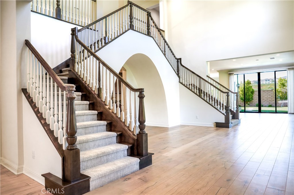111 Lanzon Irvine, CA 92602 - Photo 5 of 42 a view of staircase with wooden floor and a rug