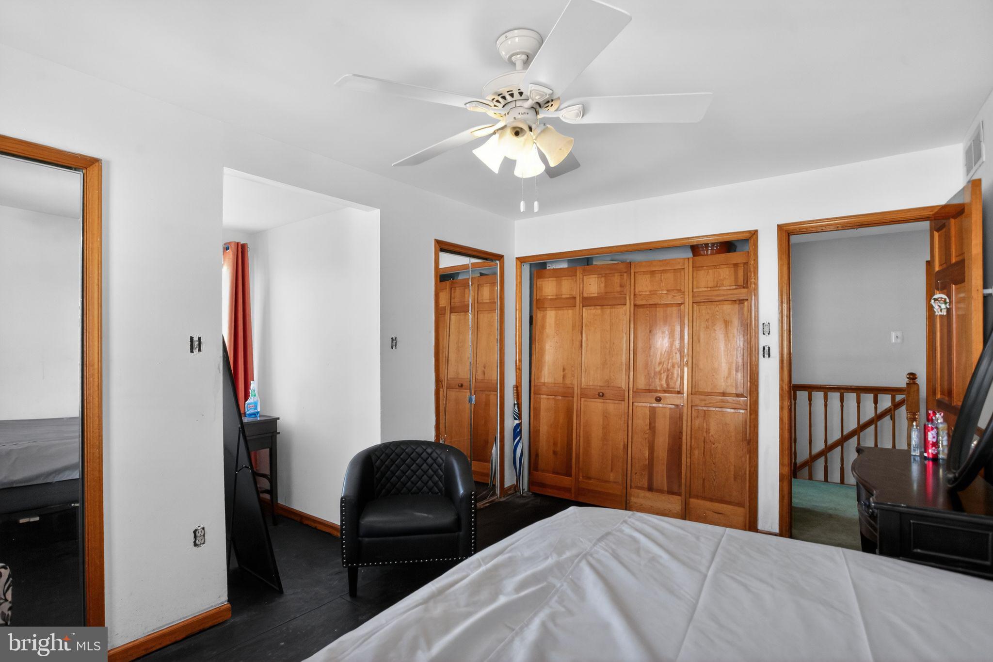 4508 Benson Street Philadelphia, PA 19136 - Photo 19 of 26 a bedroom with a bed and a chandelier