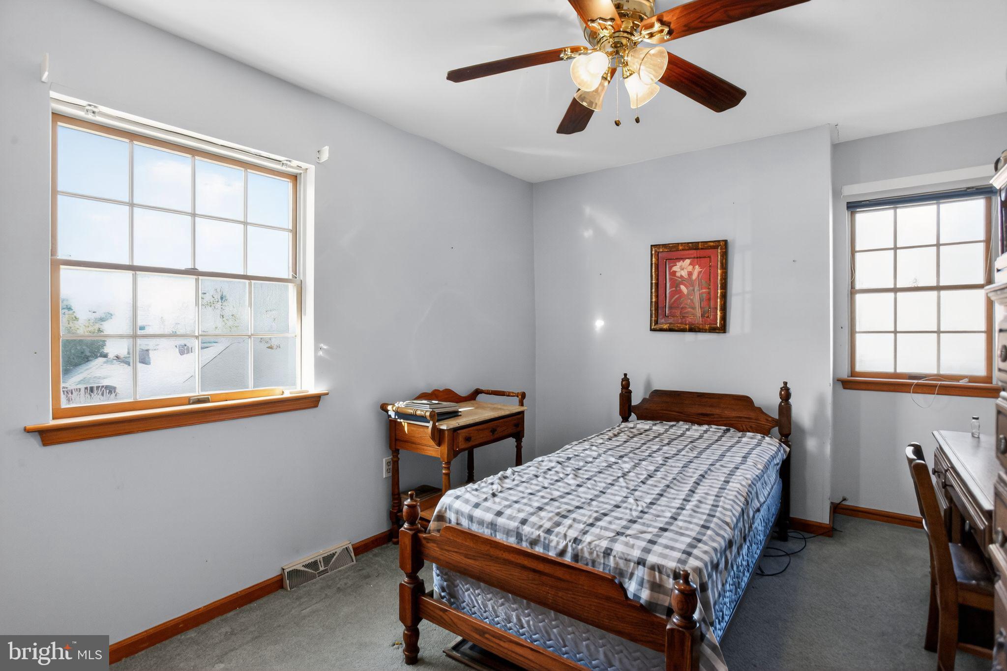 4508 Benson Street Philadelphia, PA 19136 - Photo 20 of 26 a bedroom with a bed and a window