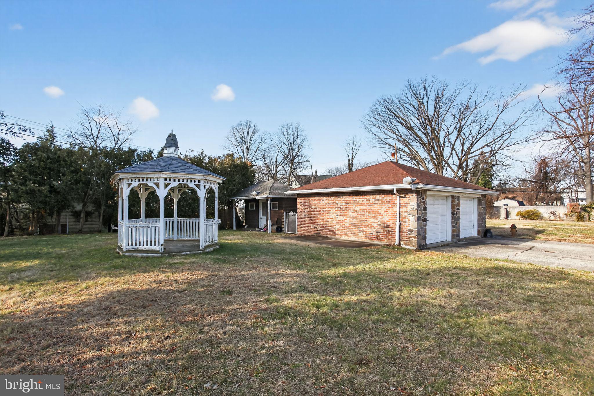 4508 Benson Street Philadelphia, PA 19136 - Photo 25 of 26 a view of a house with a yard and sitting area
