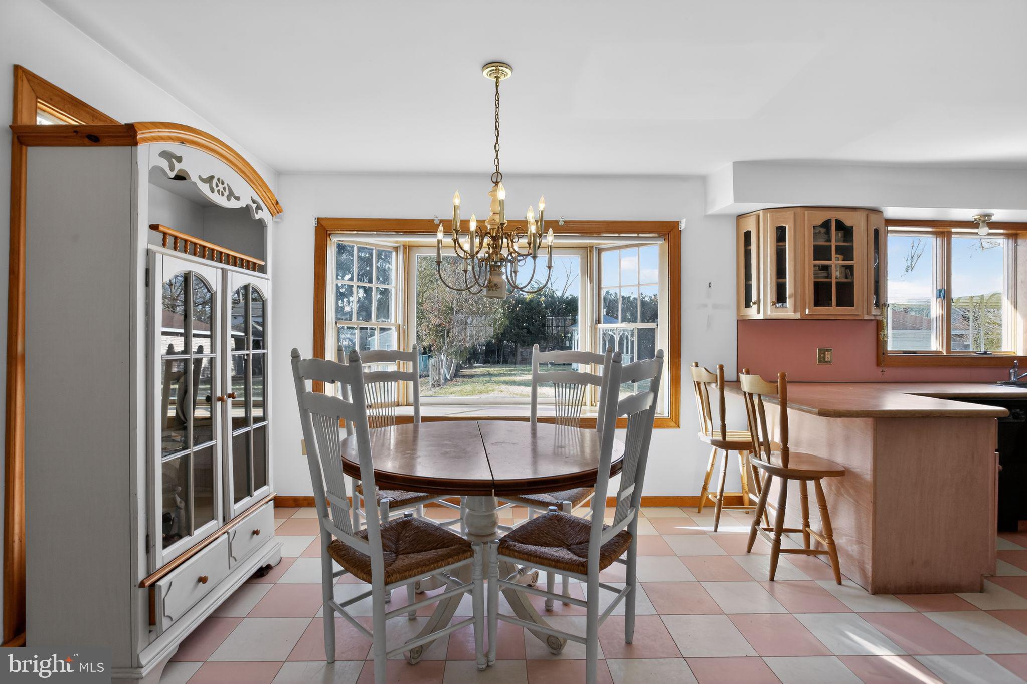 4508 Benson Street Philadelphia, PA 19136 - Photo 8 of 26 a dining room with furniture a chandelier and window