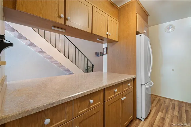 a view of entryway with wooden floor