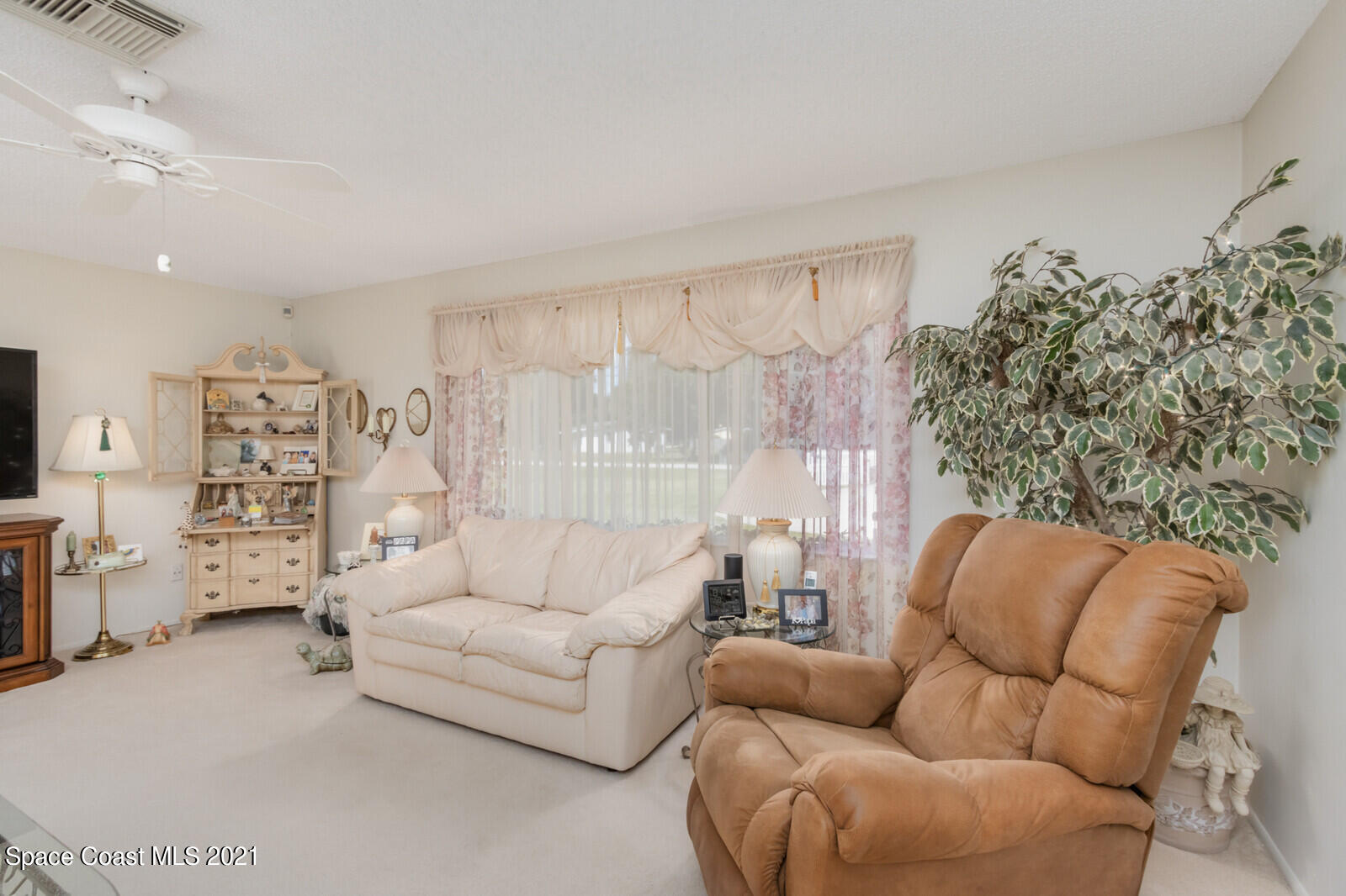 1953 Trimble Road Melbourne, FL 32934 - Photo 13 of 70 a living room with furniture and a couch