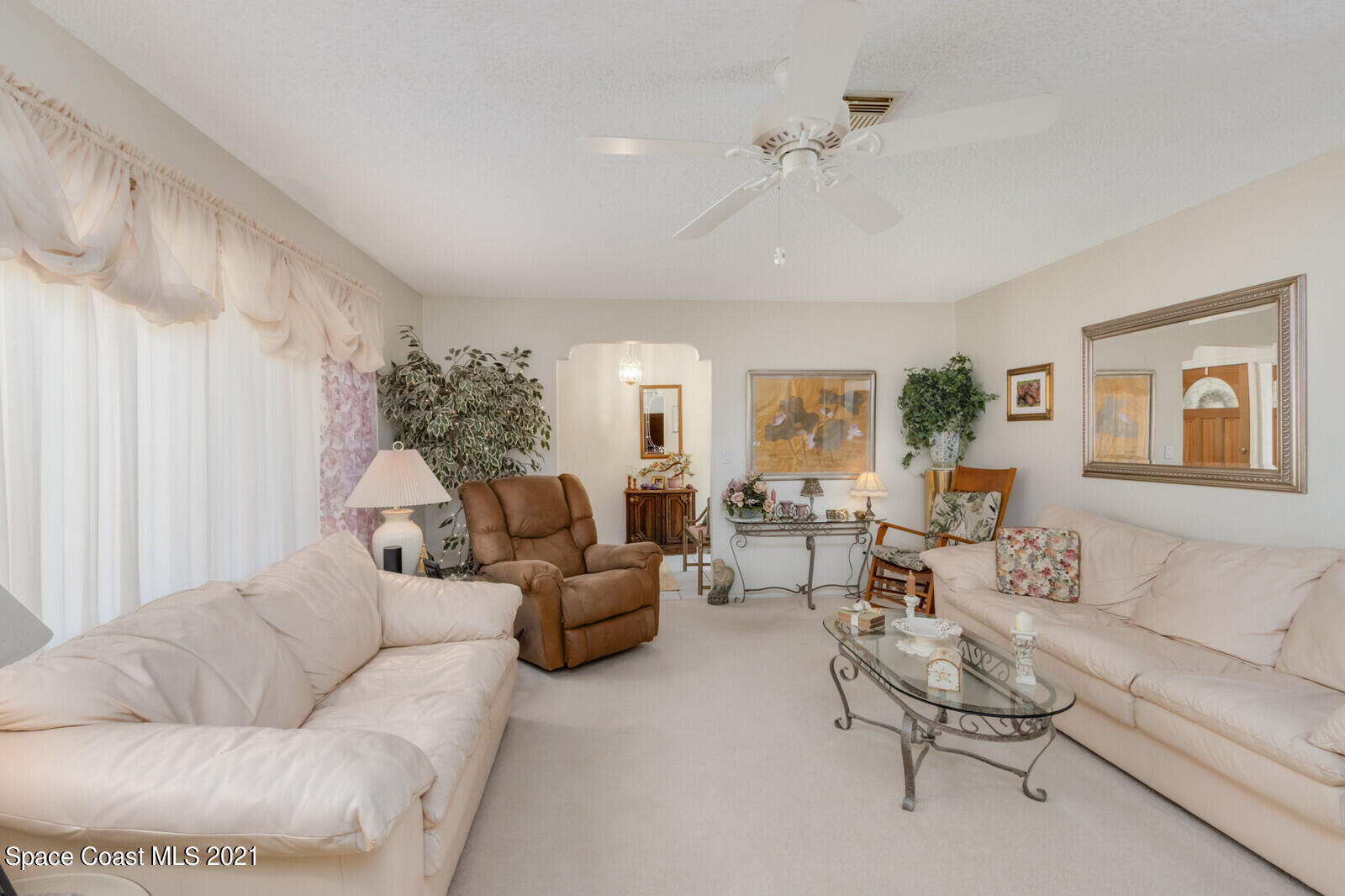 1953 Trimble Road Melbourne, FL 32934 - Photo 14 of 70 a living room with furniture and a large window