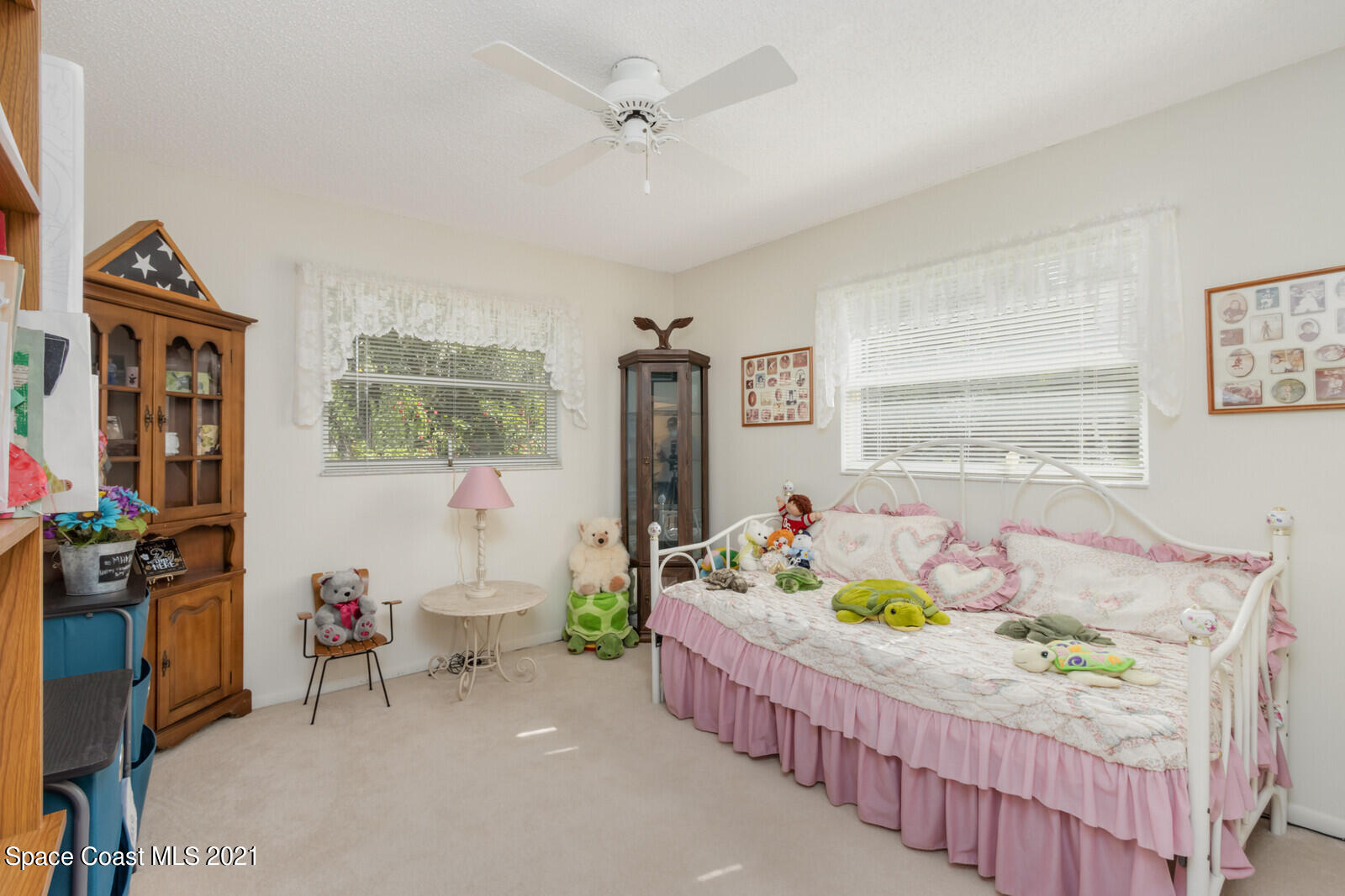 1953 Trimble Road Melbourne, FL 32934 - Photo 21 of 70 a bedroom with furniture a baby crib and a window