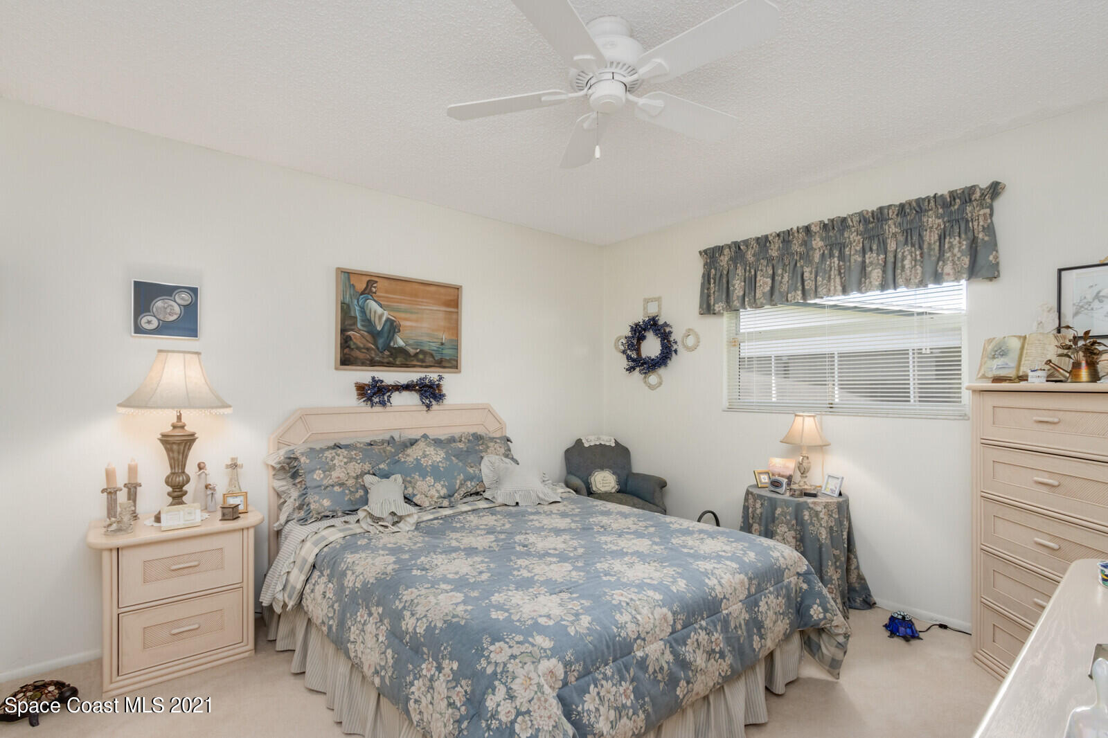 1953 Trimble Road Melbourne, FL 32934 - Photo 22 of 70 a bedroom with a bed and a table